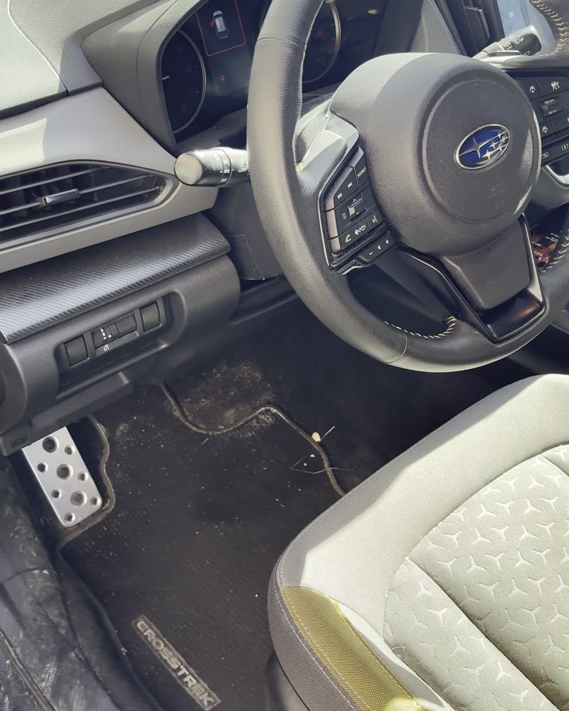 Driver seat and footwell before an interior detail